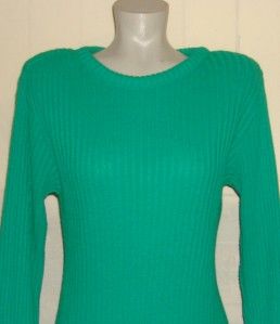 This Vintage Kelley Green Sweater Dress is acrylic with shoulder pads