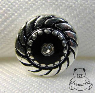 black swirl charm made by lottie dotties
