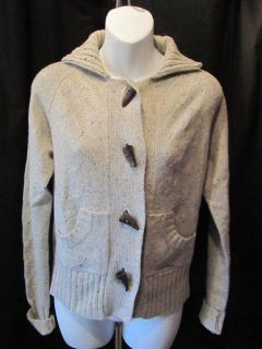 Beautiful cardigan sweater by Lily McNeal. Buttons up the front with