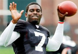 Vick and teammate RB Warrick Dunn (1,140) became the first