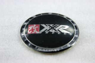 XXR Wheels Center Cap. The outer cap is flat black, and the XXR Wheels