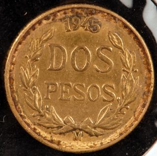 Peso Coin (restrike) pulled from a jewelry bezel. Coin shows rim