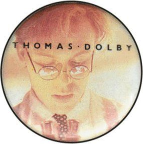 Thomas Dolby   In Supsenders with Tie and Glasses Looking